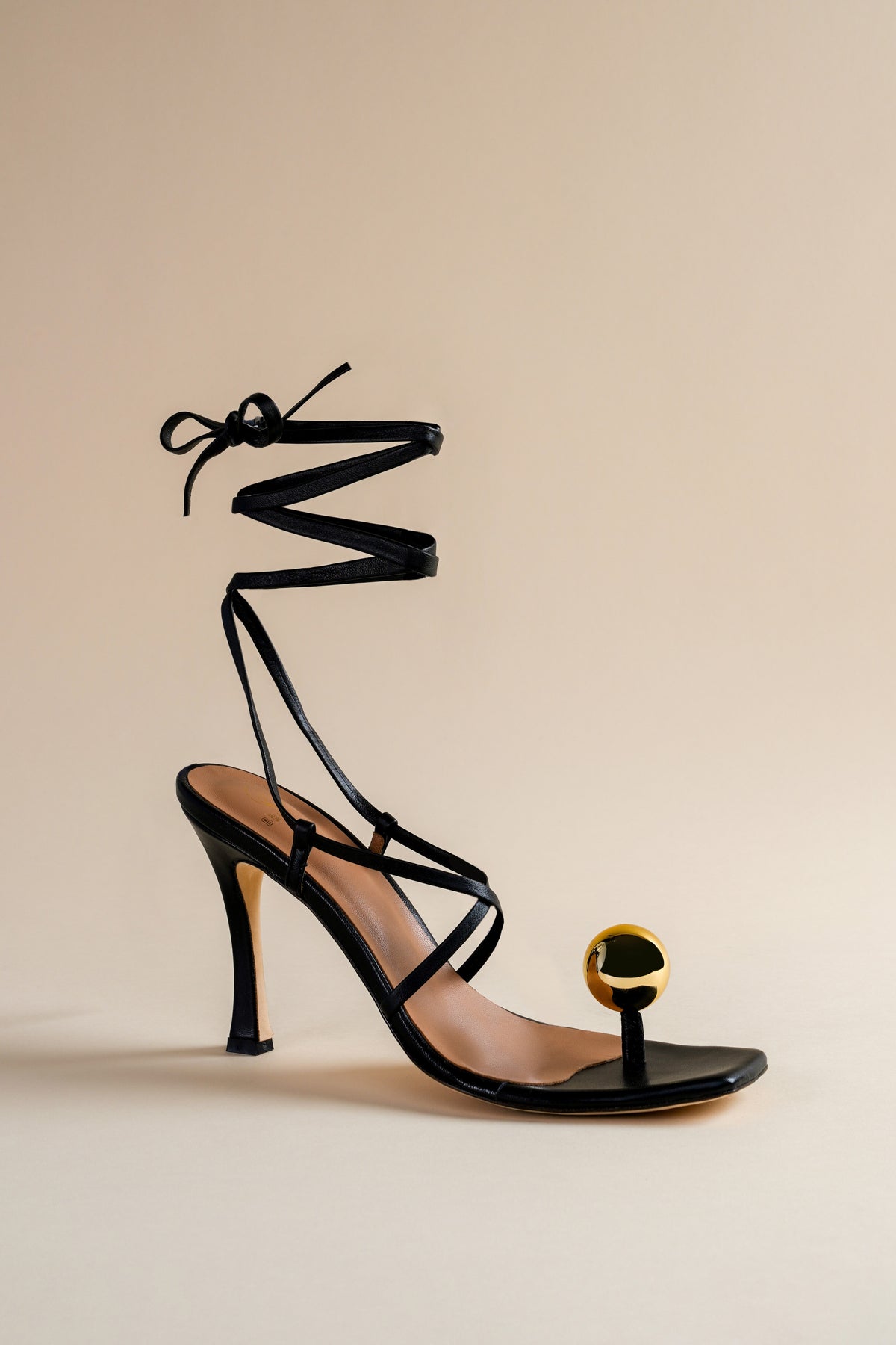 Globe sandal in black nappa leather and golden globe